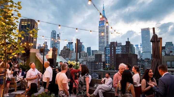 Rooftop gathering overlooking the New York City skyline
